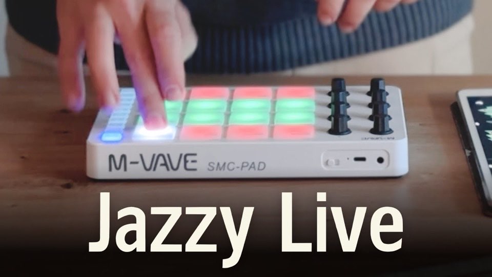 Fingers playing the lit pads of an M-VAVE SMC-PAD